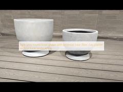 light grey round bowl shape with pedestal base fiber clay planter architectural landscaping