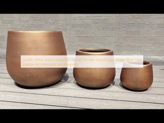 goden delux warm metallic - toned brown  round egg shape fiber clay planter architectural landscaping