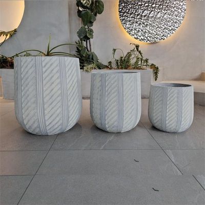 Buy Waterproof and Fireproof Fiber Clay Flower Planters with Modern Hand Carving Design online manufacture