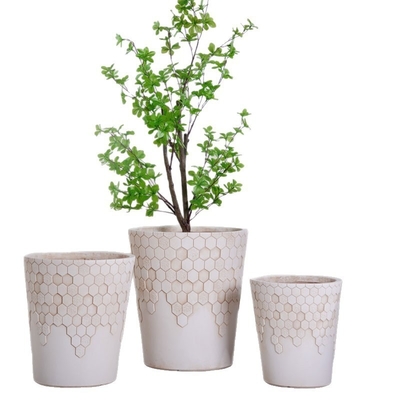 Buy neutral beige round fiber clay planter with smooth honeycomb pattern lightweight durable low-maintainence flower pot holiday Villa hotel shopping mall office decoration garden landscaping project online manufacture
