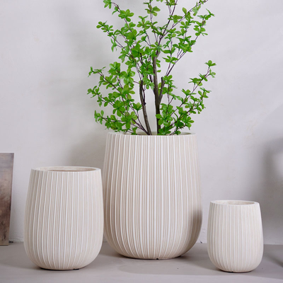 neutral beige round fiber clay planter with vertical lines pattern lightweight durable low-maintainence flower pot holiday Villa hotel shopping mall office decoration garden landscaping project