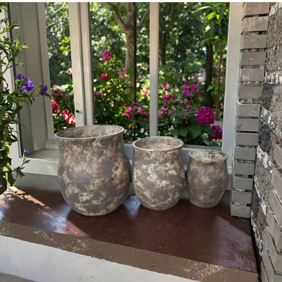 gray with some beige mottlings round fiber clay planter with  a weathered, mottled texture lightweight durable low-maintainence flower pot holiday Villa office decoration garden landscaping project