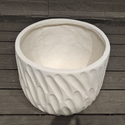 white round fiber clay planter with curved, flowing ocean breeze pattern lightweight durable low-maintainence flower pot holiday Villa office decoration garden landscaping project