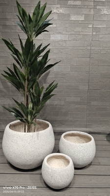 neutral beige natural speckled stone -mimic design round fiber clay planter lightweight durable low-maintainence flower pot holiday Villa office decoration garden landscaping project