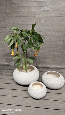 neutral beige natural speckled stone -mimic design round fiber clay planter earthy aesthetic lightweight durable low-maintainence flower pot holiday Villa office decoration garden landscaping project