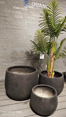 timeless modern style black round fiber clay planter with a smooth matte pattern lightweight durable low-maintainence flower pot holiday Villa office decoration Rooftop Gardens landscaping project